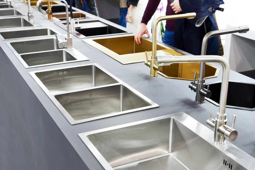 Modern kitchen water faucets and kitchen sinks in the store