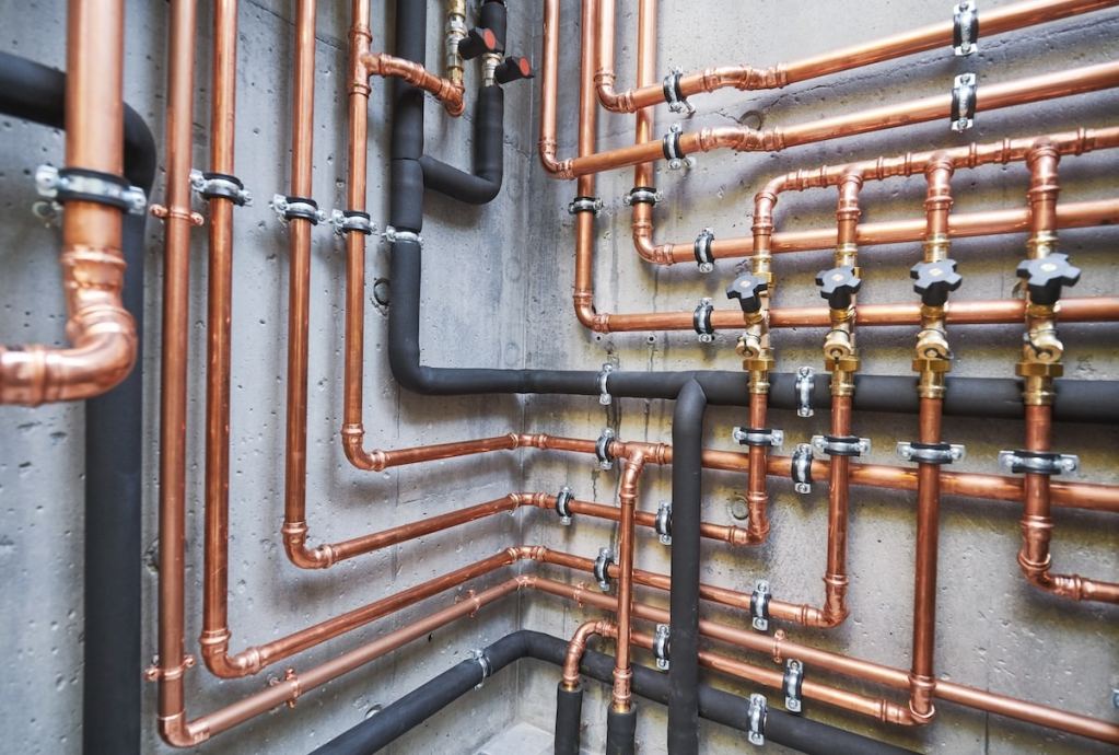 copper pipes of a private house autonomous heating system in boiler room. pipes