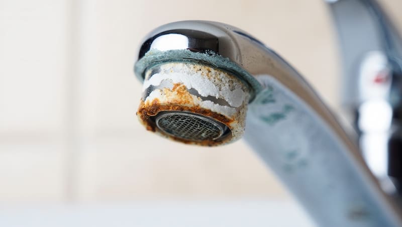 chalky residue low water pressure