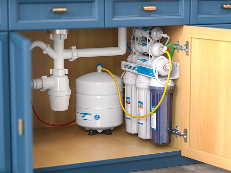 Reverse osmosis water purification system under sink in a kitchaen.  Water cleaning system installation. 3d illustration