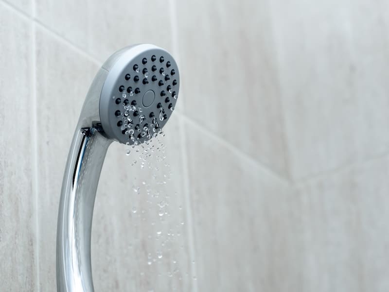 Shower head with low water stream. Broken shower in the bashroom